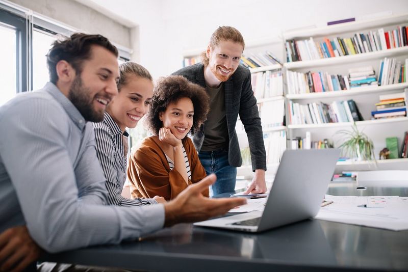 work professionals looking at laptop