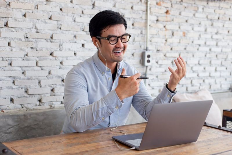 a man looking at his laptop