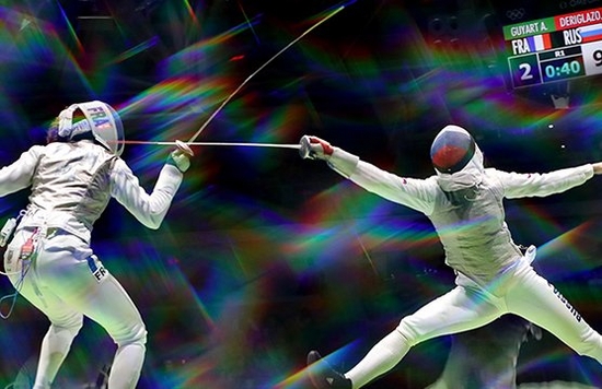 people engaging in fencing challenge
