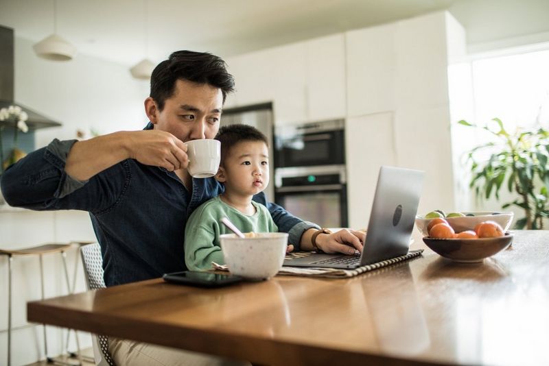 Father working from home showing how digital technology is changing business