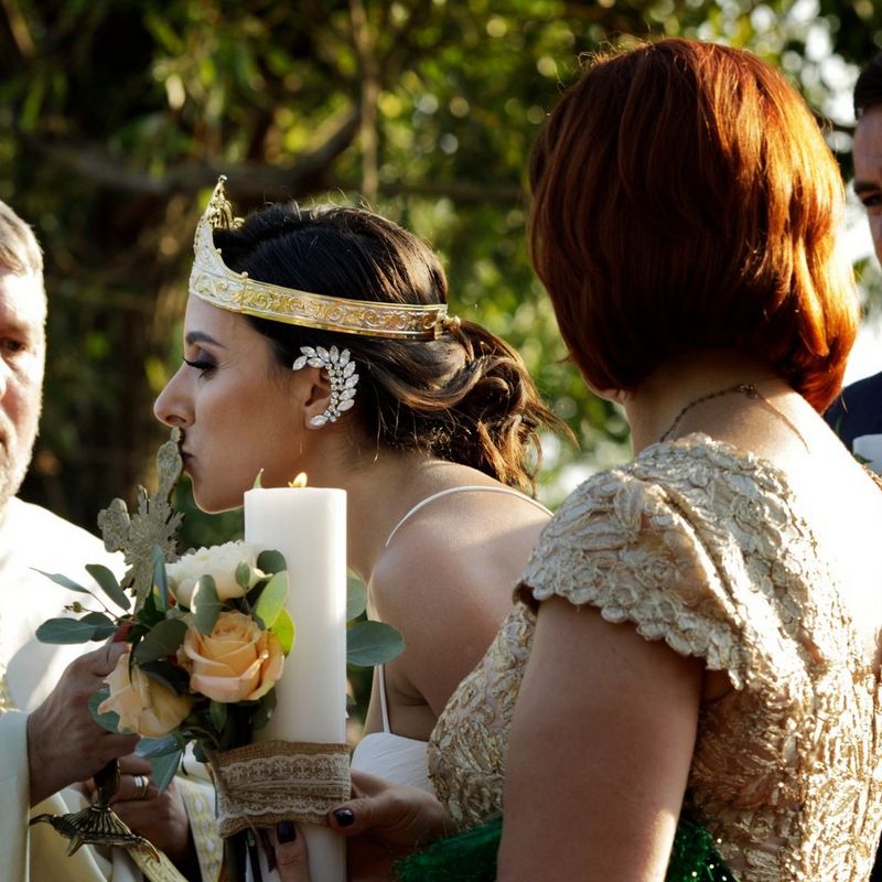 Scenes at Romanian wedding - Bride kissing Cross - taken with a EOS 5D Mark IV