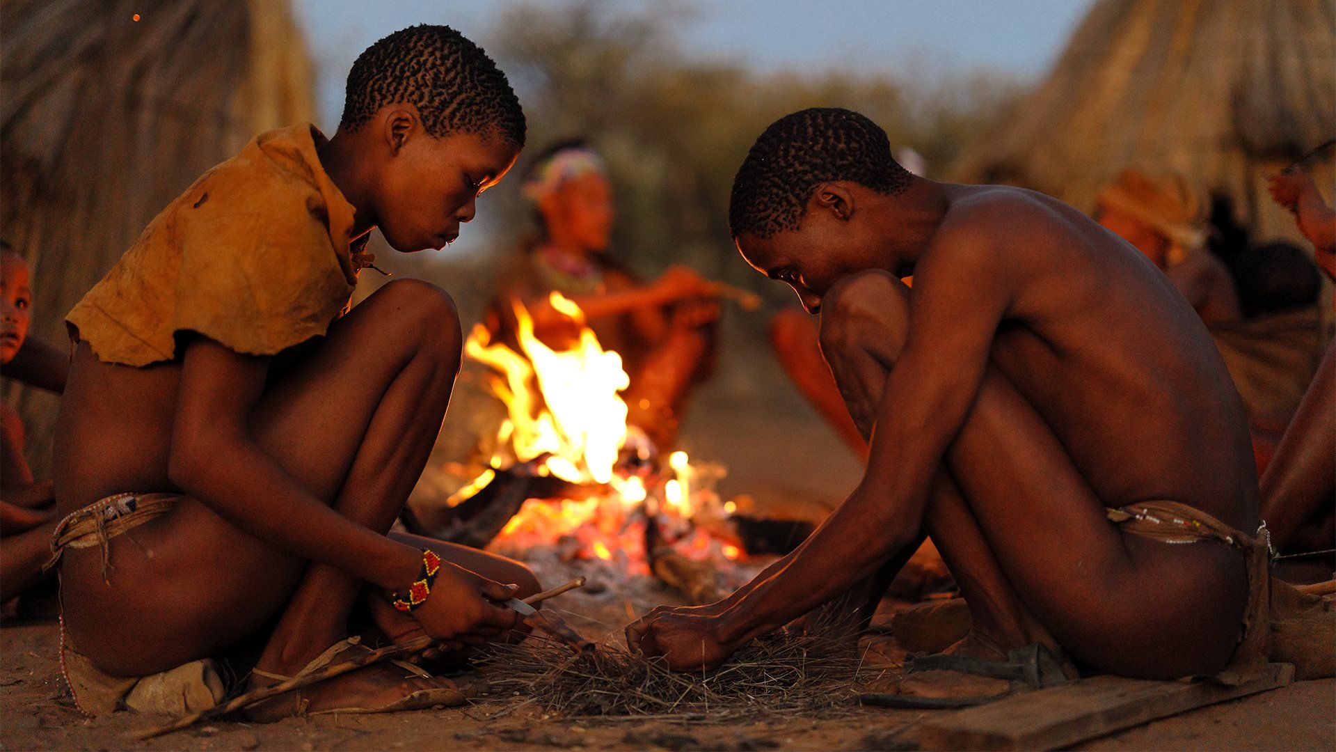Brent Stirton two males starting a fire sample
