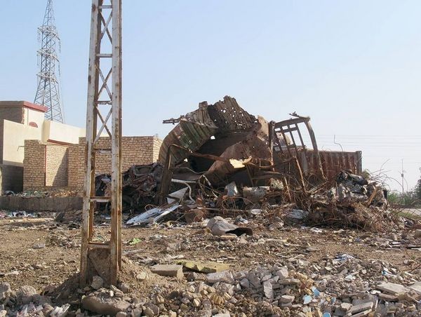 A photograph of a collapsed building, due the the conflict within Iraq.