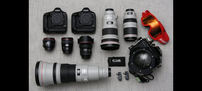 Canon Ambassador Alessandro Trovati's kitbag contents, including Canon cameras and lenses.