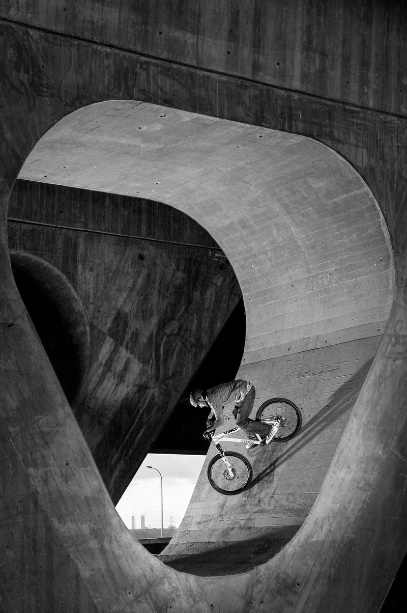 A BMX rider cycles through the supports of a bridge in Madrid, Spain, taken by Canon Ambassador Jaime de Diego on a Canon EOS-1D Mark II.