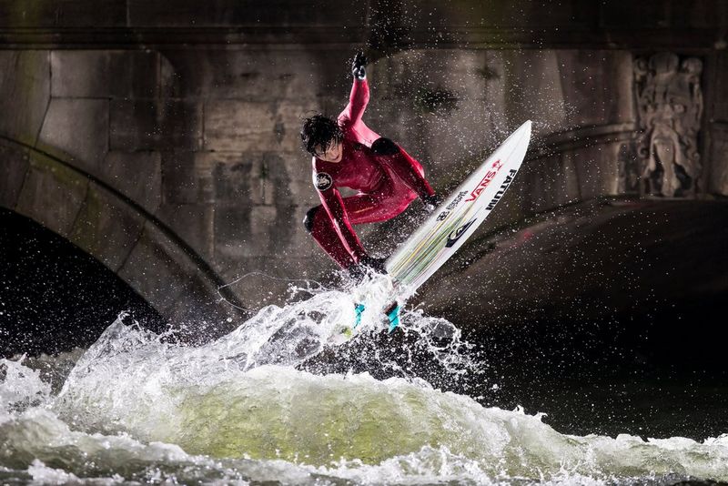 Surfer Tao Schirrmacher rides a powerful wave, photographed by Samo Vidic on a Canon EOS-1D X Mark II.