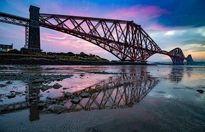 bridge silhouette over purple sky