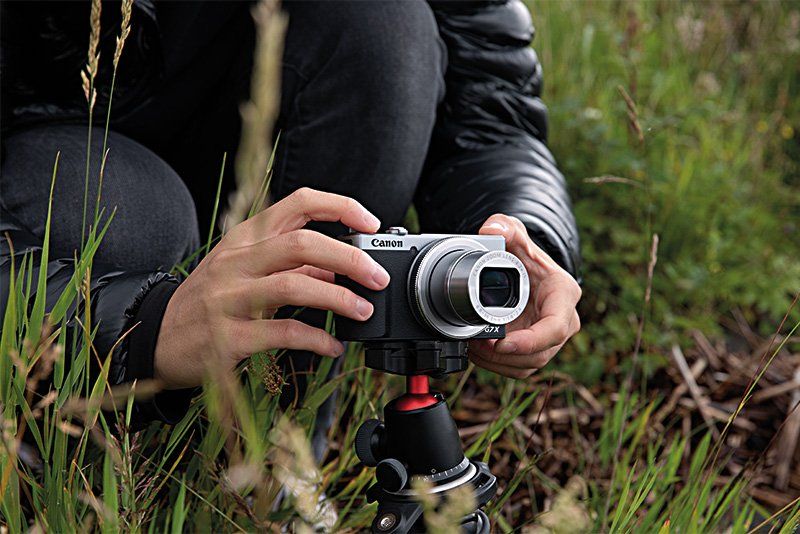 Vlogger Mike Gray sets up a Canon PowerShot G7 X Mark III on a tripod low to the grou