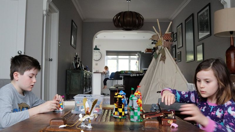 A brother and sister play with toys on a table. Taken on a Canon EOS M50 by Katja Gaskell.
