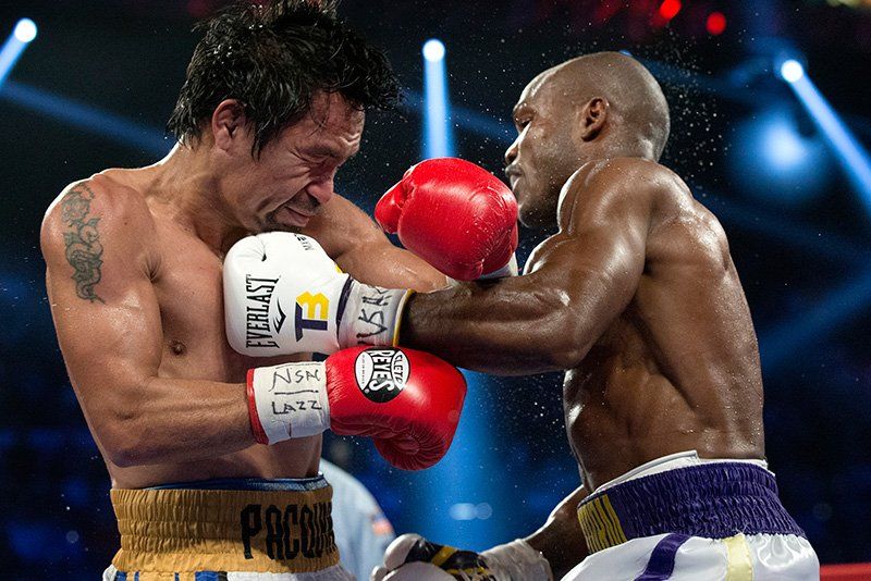 Boxers Manny Pacquiao and Timothy Bradley Jr. fight. Photo by Elizabeth Kreutz.