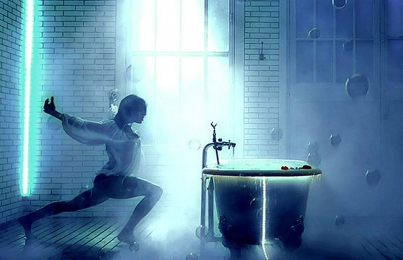 dancer poses next to bath tub