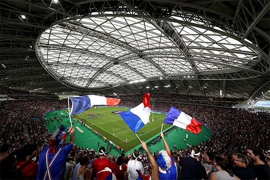 Fans wave French flags at the Wales v France quarter final match in the Oita Stadium. Taken on a Canon EOS-1D X Mark II.