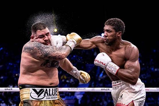 Anthony Joshua lands a punch in his rematch against Andy Ruiz Jr. Photo by Richard Heathcote