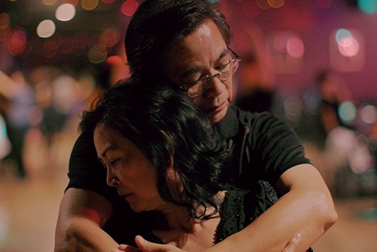 A couple embrace, in a still from Oscar-nominated documentary Walk Run Cha-Cha.
