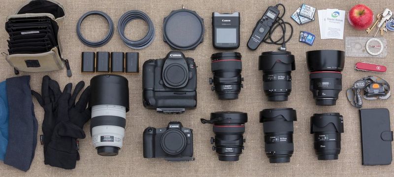 David Noton's kitbag, containing Canon camera bodies including an EOS R, plus a range of Canon lenses.