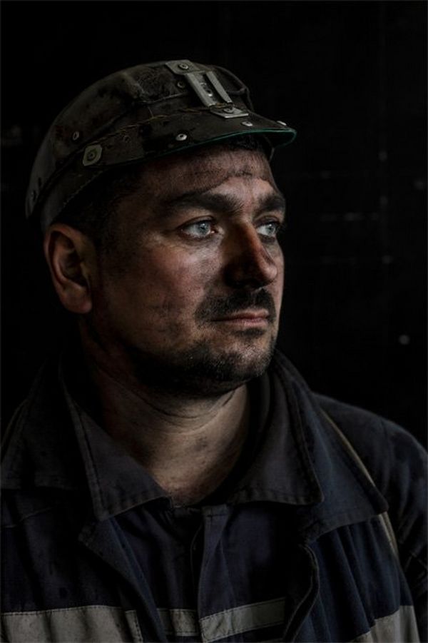 A portrait of a miner with coal dust covering his face – you can see it in every pore.