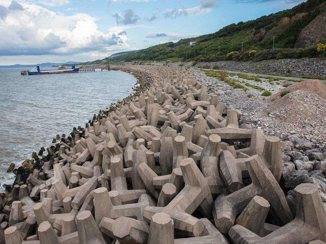What appears to be a rocky seashore is actually made up of interlocking concrete shapes, photographed by David Hurn on a Canon EOS 5DS R.