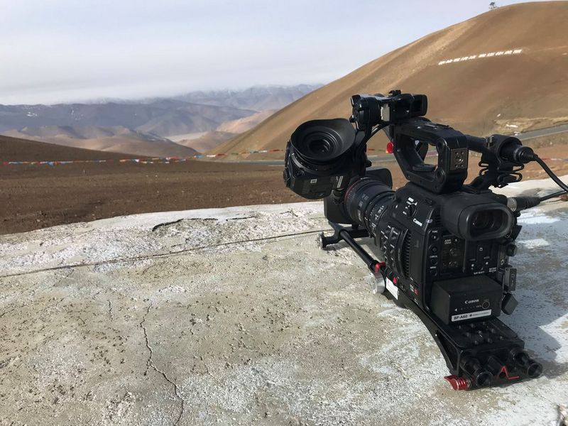 A Canon EOS C200 video camera on a rock.