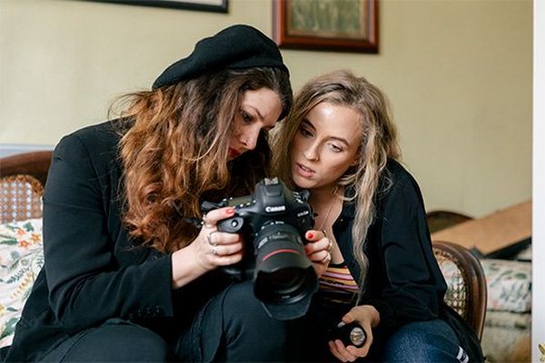 Fashion photographer Wanda Martin shows Rianna Gayle a picture on her Canon EOS-1D X Mark IIs screen.