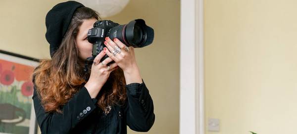 Photographer Wanda Martin takes a picture with a  Canon EOS-1D X Mark II.