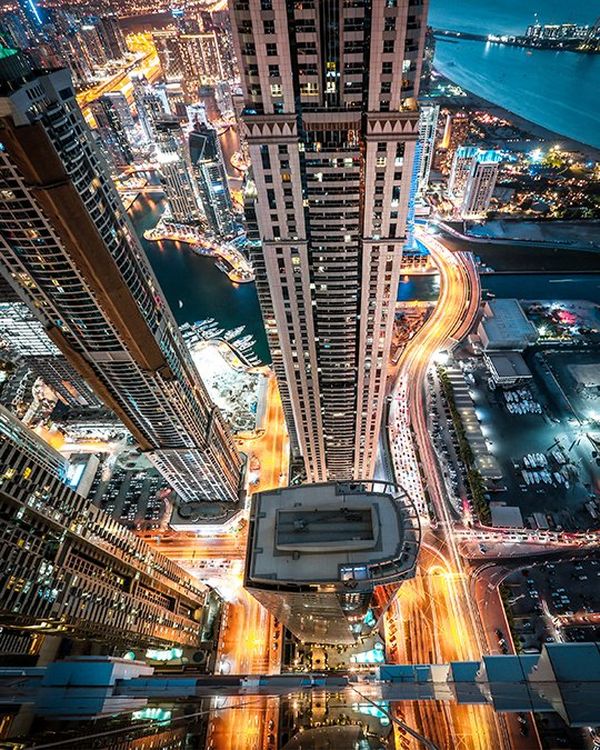 A view from one of the high rises in Dubai Marina, with a long exposure of the car lights far below reflected onto the glass in a mesmerising way.