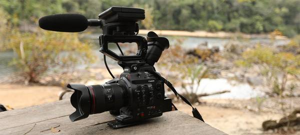 A Canon EOS C300 Mark II on a piece of wood beside the Essequibo River.