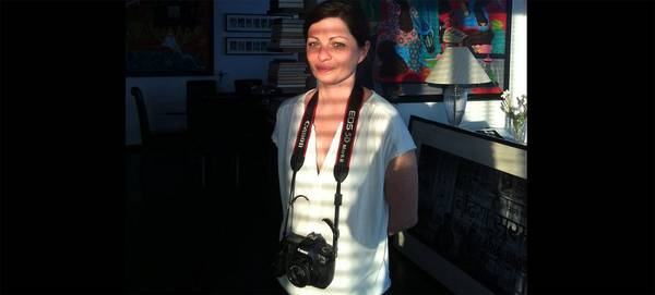Magnum photographer Olivia Arthur with a Canon EOS 5D Mark II around her neck