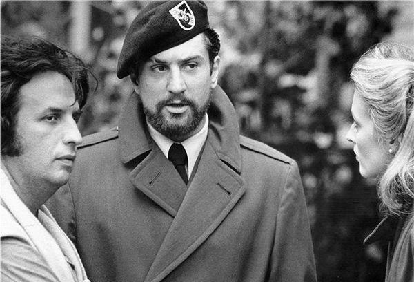 Michael Cimino and Robert De Niro in costume and on set for The Deer Hunter.