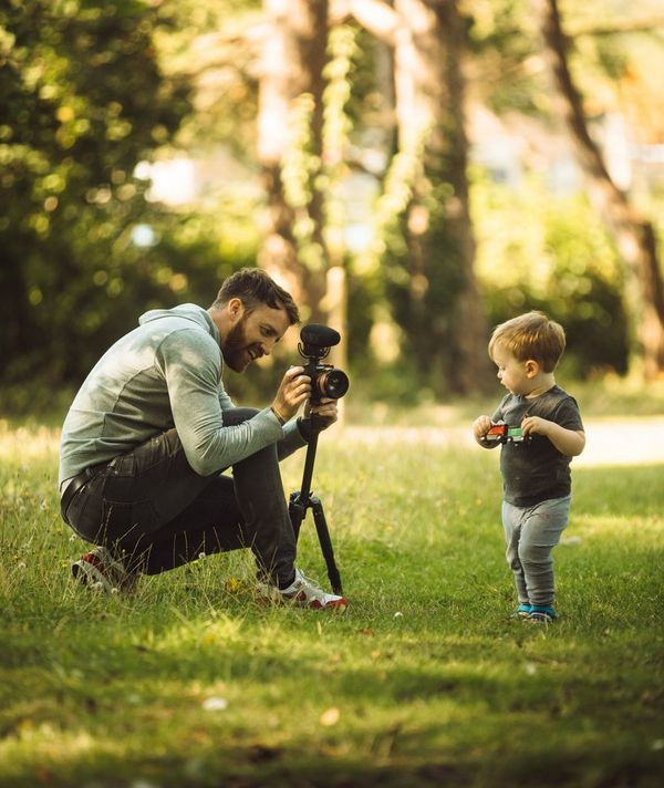 Stefan Michalak filming a toddler in the park. 