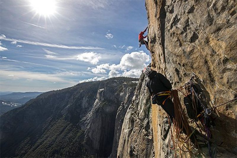 Two men scale the sheer cliff face of El Capitan in Yosemite National Park, where Oscar-winning documentary Free Solo was filmed using Canon equipment.