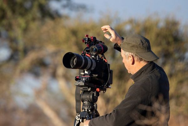Second camera operator Bosie Vincent adjusting the Canon EOS-1D X Mark III on top of a tripod.