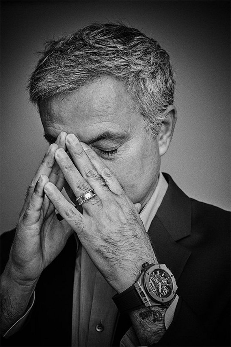A black and white portrait of José Mourinho covering part of his face with his hands, in disappointment. Portrait by David Turecký on a Canon EOS 6D.