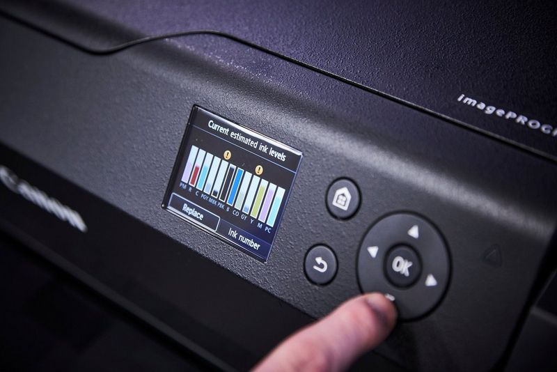 A close-up shot of the display on a Canon PROGRAF printer showing the ink levels.