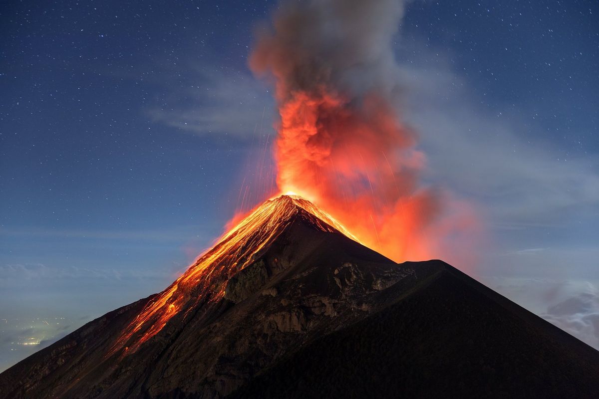 Smoke clouds and lava erupting from the Fuego volcano in Guatemala. Taken by Joel Santos.