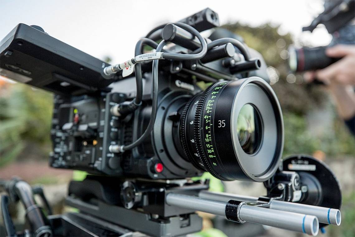 A Canon Sumire Prime cine lens in use on a cine camera on location.
