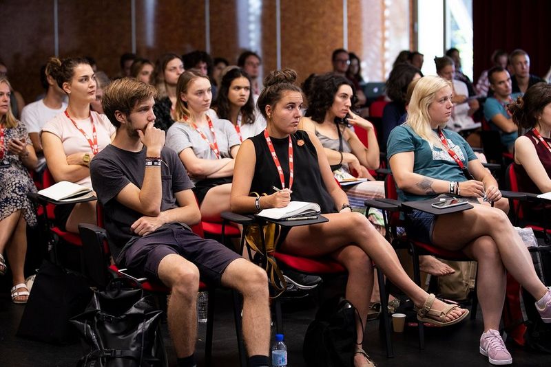 Photojournalism students in a lecture hall at Visa pour l'Image 2019.