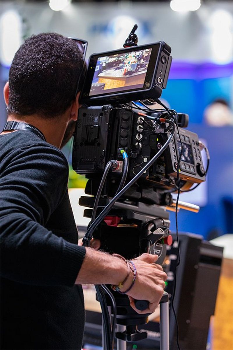 A man trying out a Canon cine camera at IBC.
