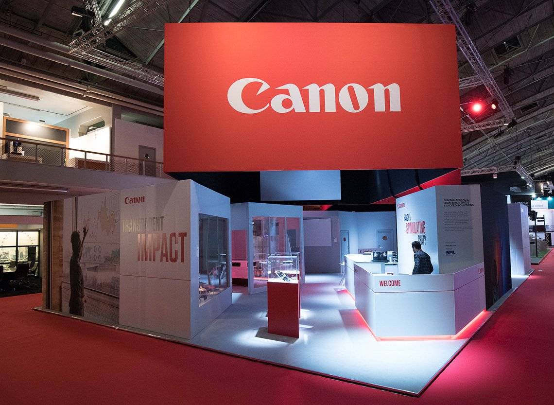 The Canon stand at the ISE trade show, with inspiring photography on displays, projectors and Canon products ready to try, and an expert standing by.