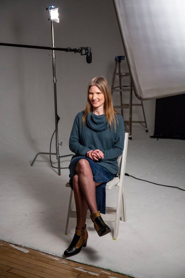 Cinematographer Laela Kilbourn sitting on a chair. 