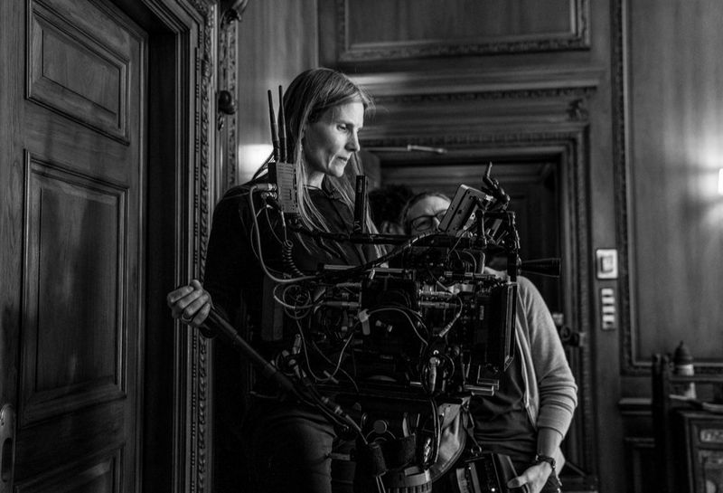 Cinematographer Laela Kilbourn operating a cine camera.