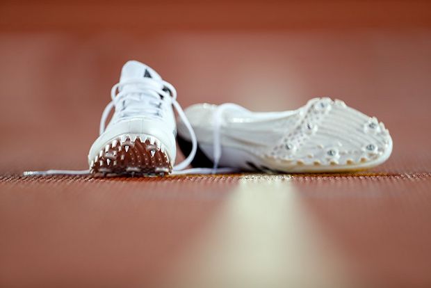 running shoes left on track
