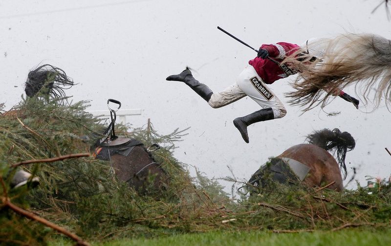 Tom Jenkins snaps Nina Carberry coming off her horse during the Grand National, with his Canon EOS-1D X.
