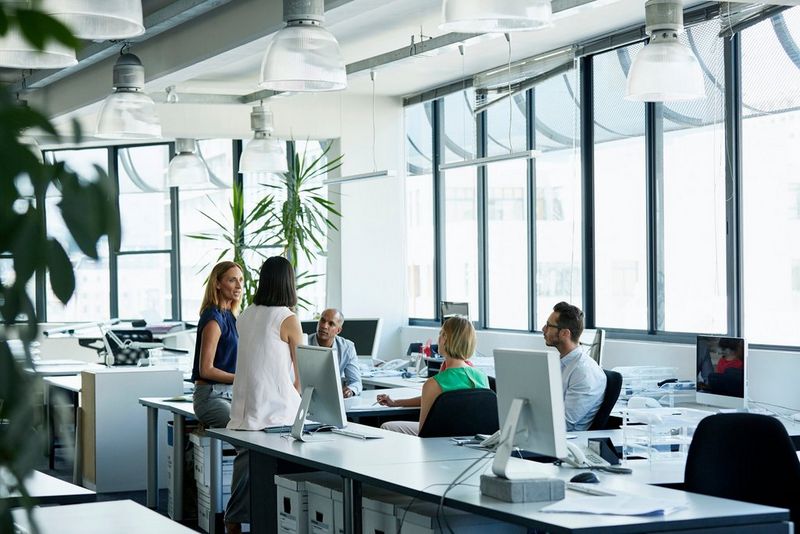 Confident Professionals Discussing in Office  