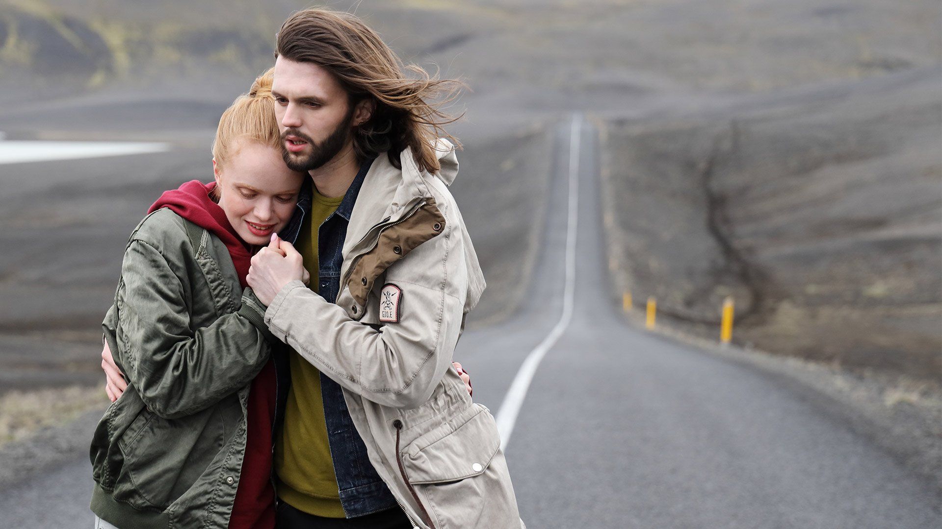 Cold couple walking up a long road in Iceland shot on Canon EOS R and RF 24-105mm F4L IS USM