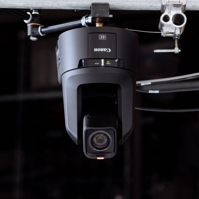 A Canon CR-N700 PTZ camera fixed on a metal bar. 