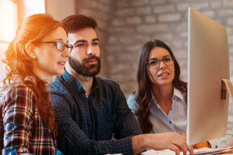 People looking at a monitor