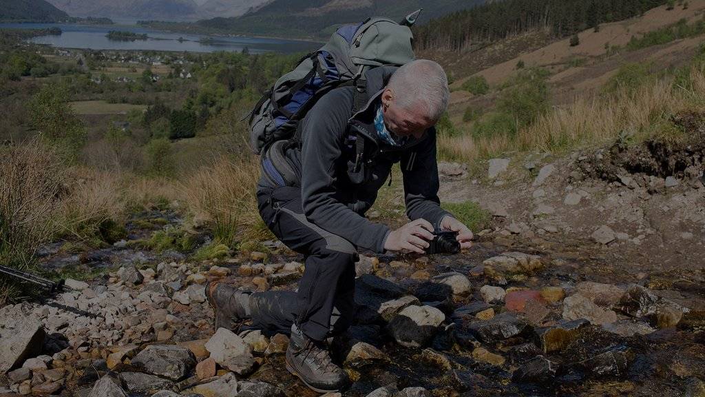 Alan Rowan using the Canon PowerShot SX740 HS to photograph a stream