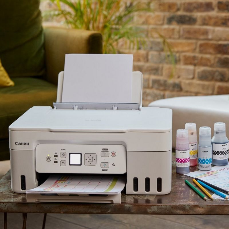 Skrivare med påfyllningsbara bläckbehållare