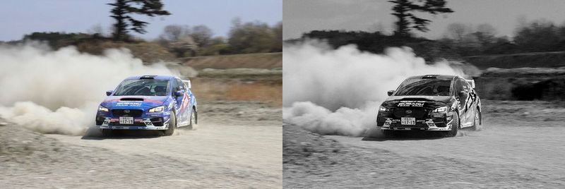 racecar blows up dust on track in black & white