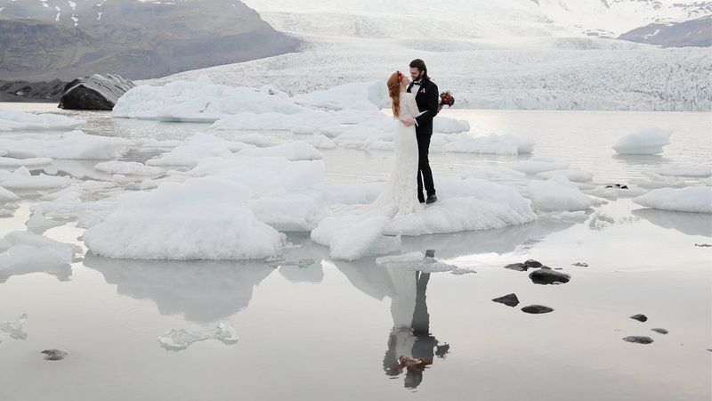 Eloped couple during ceremony on ice in Iceland shot on Canon EOS R & RF 24-105mm F4L IS USM